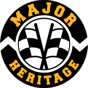 This is the logo for Major Heritage. It is a roundel with two crossed chequered flags in the center and the words Major above and Heritage below around the edge of the circle.