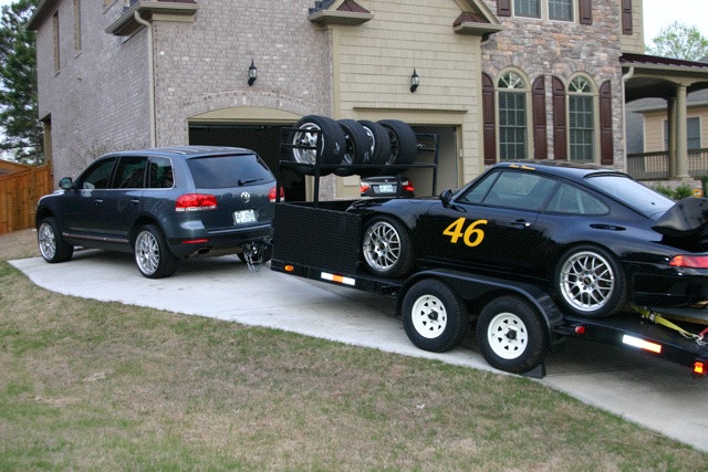 black Porsche track car on a trailer