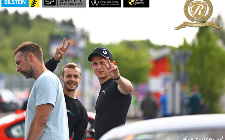 Happy people at the Nurburgring trackdays 2024, waving at the camera.
