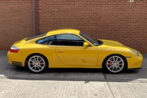 A yellow Porsche 911 outside suspension experts Center Gravity
